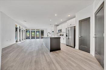 A modern kitchen with a large island and stainless steel appliances at Luxe 360 on Centerpointe Apartments, Midlothian, VA, 23114